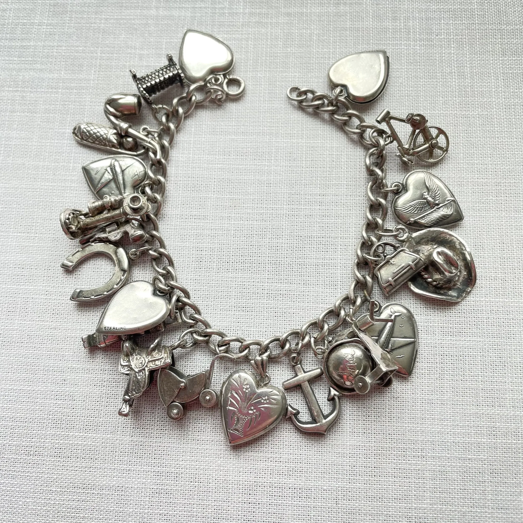 SOLD Vintage 40s WWII Sterling Charm Bracelet, Puffy Hearts/Southwestern/Calif/Military Sweethearts 22 Charms